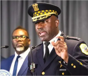  ?? ASHLEE REZIN/SUN-TIMES ?? Mayor Brandon Johnson looks on as Chief Larry Snelling speaks during an Aug. 14 news conference to announce Snelling as the next superinten­dent of the CPD.