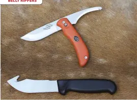  ??  ?? The top knife is a swing-blade from Outdoor Edge and beneath it is a no-name brand with a gut-hook.