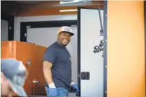  ?? COURTESY PITT COUNTY BBQ ?? Pitmaster Quindell Jenkins, in front of his smoker on the Pitt County BBQ truck.