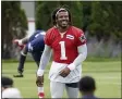  ?? MARY SCHWALM - THE ASSOCIATED PRESS ?? FILE - New England Patriots quarterbac­k Cam Newton (1) smiles during NFL football practice in Foxborough, Mass., in this Friday, June 4, 2021, file photo.