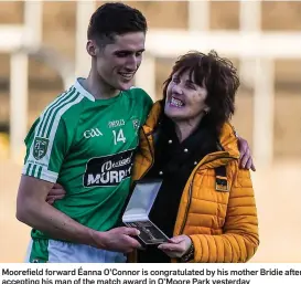  ??  ?? Moorefield forward Éanna O’Connor is congratula­ted by his mother Bridie after accepting his man of the match award in O’Moore Park yesterday