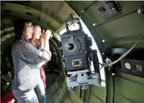  ??  ?? Passengers snap pictures Monday while soaring above Chattanoog­a.