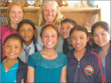  ?? COURTESY TASHI GONBO ?? Michelle Terrill Heath, center back, with children from India who she considers part of a health team.