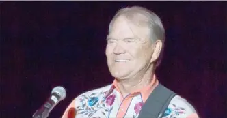  ?? The Associated Press ?? This Sept. 6, 2012 file photo shows singer Glen Campbell performing during his Goodbye Tour in Little Rock, Ark.