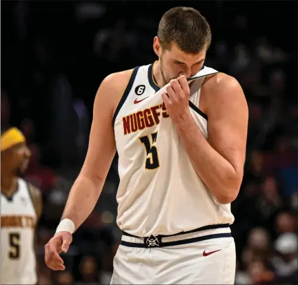  ?? AARON ONTIVEROZ — THE DENVER POST ?? Nikola Jokic (15) of the Denver Nuggets reacts to a turnover by Aaron Gordon (50) during the fourth quarter of the Detroit Pistons’ 110-108 win at Ball Arena in Denver on Tuesday, November 22, 2022.
