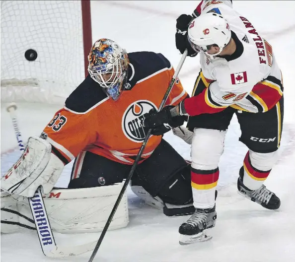  ?? ED KAISER ?? Connor McDavid got most of the headlines with three goals in Edmonton’s opening-night win over the Calgary Flames, but Oilers goalie Cam Talbot also did his part with 27 saves in the 3-0 win. “Our best players were backchecki­ng hard and leading the way...