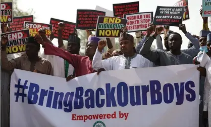  ?? Photograph: Kola Sulaimon/AFP/Getty Images ?? A rally to urge the rescue of the 300 abducted schoolboys earlier yesterday.