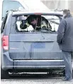  ?? JOHN MAHONEY ?? Police inspect a van allegedly used by suspects who shot dead Yannick Larose in a Terrebonne parking lot Monday.
