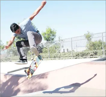  ?? Nikolas Samuels/The Signal ?? Brian Vargas, 21, does a trick as he catches air on his skateboard at Santa Clarita Skate Park on Thursday.