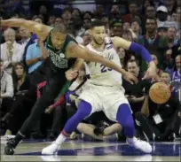 ?? MATT SLOCUM — THE ASSOCIATED
PRESS ?? The Boston Celtics’ Al Horford, left, and Philadelph­ia 76ers’ Ben Simmons chase the ball during the second half of Game 3 of an NBA basketball second-round playoff series, Saturday in Philadelph­ia.