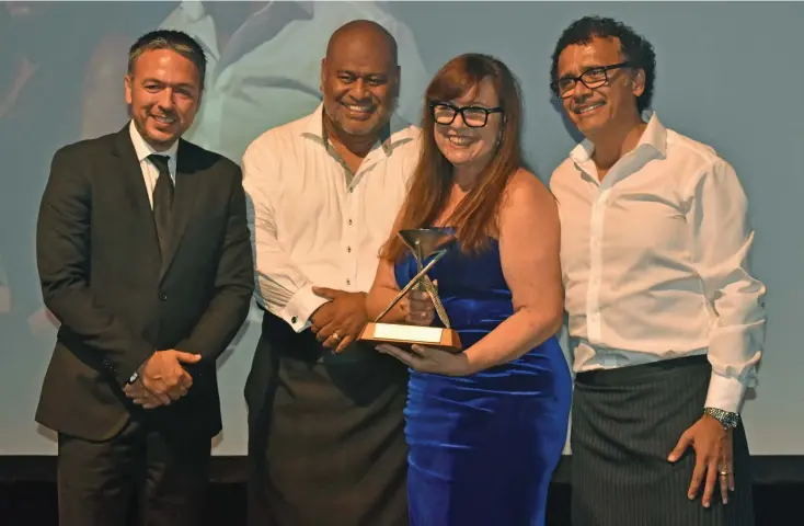  ?? Photo: Waisea Nasokia ?? Sofitel Fiji Resort and Spa general manager Vincent Macquet hands over the award to Rosie Holidays Group general manager Eroni Puamau and creative director Brigid Whitton, and managing director Tony Whitton during the 2022 Fiji Excellence Tourism Awards at the Sofitel Fiji Resort and Spa on February 25, 2023.