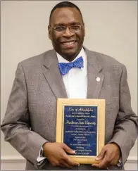  ??  ?? Glendell Jones, president of Henderson State University, accepts the Arkadelphi­a Cultural and Racial Diversity Award during the chamber’s annual banquet March 2. The city of Arkadelphi­a’s Racial and Cultural Diversity Committee gives this award.