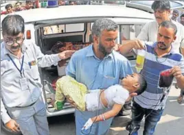  ?? NITIN KANOTRA/HT ?? An injured child being shifted to a hospital in Jammu.