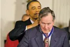  ?? ASSOCIATED PRESS FILE PHOTO ?? RIGHT: President Barack Obama awards the Medal of Freedom to Bush during a ceremony in the East Room of the White House in 2011.