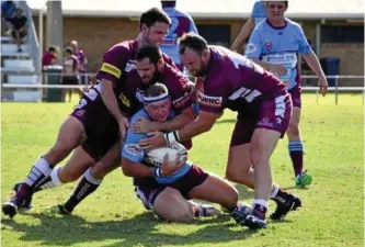  ??  ?? DIEHARDS DEFENCE: Dalby forwards Colin Green, Brent Hunt and Xavier Manley muscle up against Goondiwind­i.