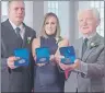  ?? CP PHOTO ?? Karl Curtis, Nicole Foran and Jerry Spargo, left to right, display the Medal of Bravery at Province House in Halifax on Wednesday.