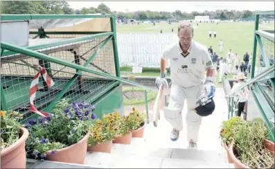  ??  ?? Dale Benkenstei­n leaves the pitch after hitting the winning runs and making 60 for Durham during the LV County Championsh­ip match at Liverpool Cricket Club in 2011.