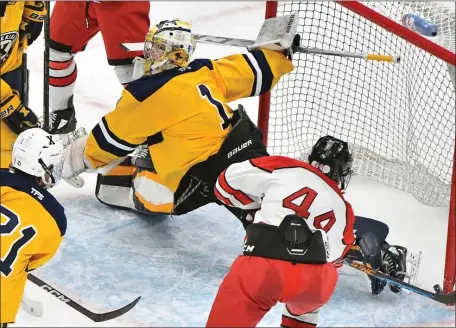  ?? STAFF PHOTO BY CHRIS CHRISTO/MEDIANEWS GROUP/BOSTON HERALD ?? Pope Francis’ Josh Iby puts the game winning goal past Xaverian’s Cole Pouliot-Porter during the D1 final at TD Garden.