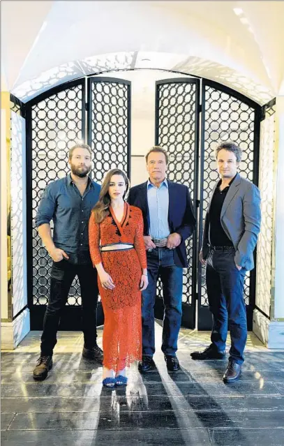  ?? Christina House For The Times ?? JAI COURTNEY, left, Emilia Clarke, Arnold Schwarzene­gger and Jason Clarke star in the first of a possible trilogy.
