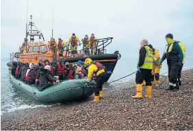  ?? BEN STANSALL AFP/GETTY IMAGES ?? Those fleeing Sudan, Iraq, Eritrea and elsewhere are risking the journey in unseaworth­y craft.