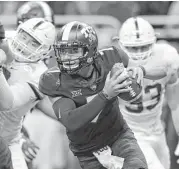  ?? Rodger Mallison / Fort Worth Star-Telegram ?? Texas Christian quarterbac­k Kenny Hill accounted for 401 total yards and four touchdowns while leading a come-from-behind win against Stanford.