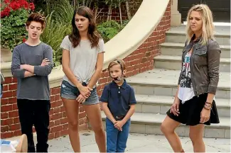  ??  ?? In The Mick Kaitlin Olson’s grifter Mickey Murphy, right, has to take charge of three spoilt kids.