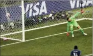  ?? FRANK AUGSTEIN — ASSOCIATED PRESS ?? France’s Paul Pogba scores his team’s third goal as he puts the ball past Croatia goalkeeper Danijel Subasic.