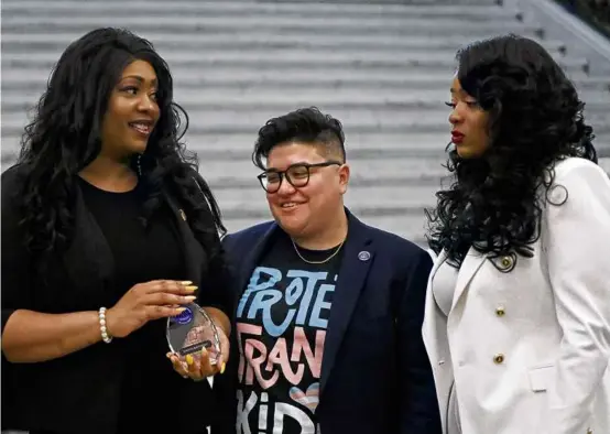  ?? PAT GREENHOUSE/GLOBE STAFF ?? Jennifer Barthelemy (left), who was recognized with a 2023 Advancing Equity & Justice Award, was joined by commission cochair Noemi Uribe (center) and executive director Shaplaie Brooks.