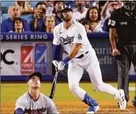  ?? Mark J. Terrill / Associated Press ?? Los Angeles Dodgers’ Joey Gallo, center, heads to first after hitting a three-run home run off Twins relief pitcher Griffin Jax, left, on Wednesday in Los Angeles.