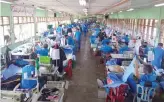  ?? Photo courtesy: Malaysian Prison Department ?? Prisoners who learned sewing as part of their vocational training make PPE masks for frontline workers battling the coronaviru­s pandemic.