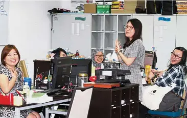  ??  ?? Happy teachers: Employees enjoying the environmen­t at the school.