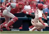  ?? JEFF ROBERSON/AP ?? The Cardinals’ Matt Carpenter, right, is tagged out by Phillies catcher Andrew Knapp during the seventh inning on Saturday in St. Louis.