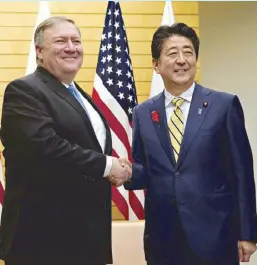  ?? AFP ?? US Secretary of State Mike Pompeo greets Japanese Prime Minister Shinzo Abe in Tokyo yesterday.