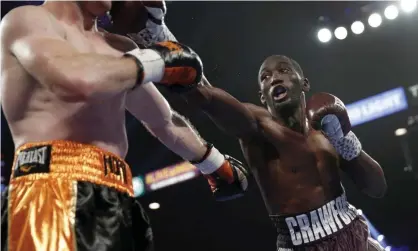  ?? Photograph: John Locher/AP ?? Terence Crawford of the United States, right, lands a punch on Australian’s Jeff Horn in Saturday’s welterweig­ht title match.
