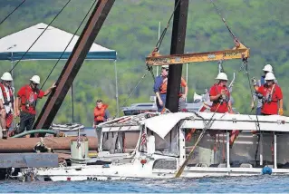  ?? [NATHAN PAPES/ THE SPRINGFIEL­D NEWSLEADER VIA AP] ?? The duck boat that sank in Table Rock Lake in Branson, Mo., is raised on Monday. The boat went down Thursday evening after a thundersto­rm generated nearhurric­ane strength winds.