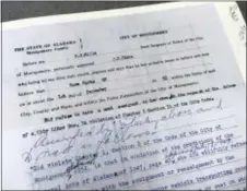  ?? ALABAMA STATE UNIVERSITY VIA AP ?? A court document filed after Rosa Parks’ arrest for refusing to give up her bus seat to a white man on a bus is displayed at the archive of Alabama State University in Montgomery, Ala. The university is preserving court documents linked to the civil...