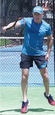  ??  ?? Chris Cahill returns serve in Riverside tennis; Photograph­s: Paul Cohen.