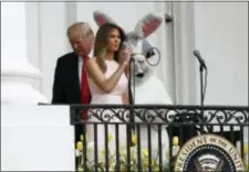  ?? CAROLYN KASTER — THE ASSOCIATED PRESS ?? First lady Melania Trump, joined by President Donald Trump and the Easter Bunny, speaks on the Truman Balcony during the annual White House Easter Egg Roll on the South Lawn of the White House in Washington, Monday.