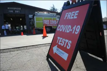  ?? BEA AHBECK/NEWS-SENTINEL ?? Free COVID-19 testing is offered at Woodbridge Fire Station on Oct. 20, hosted by the San Joaquin County Office of Emergency Services. Sacramento County has been demoted to the purple (most restrictiv­e) tier after a COVID19 spike. San Joaquin County remained in the red tier this week, but could be headed to the purple tier.