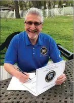  ?? PHOTO PROVIDED ?? Senator Jim Tedisco signs an Acts of Kindness Heroes Award for Deanne Savage, an eighth grade teacher at Maple Ave Elementary School.