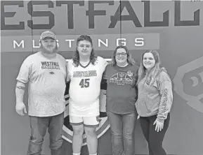  ?? COURTESY OF GRAUL FAMILY ?? Williamspo­rt Westfall senior team manager Caleb Graul, seen here with parents Charlie and Brittany and sister Madison Bowens, was celebrated at the Mustangs’ game Friday against Piketon.