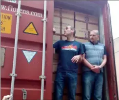  ??  ?? Andrew Burt and Peter Dowie show how tightly packed the County Wexford container truck was before it departed for Malawi, filled with festive packages.