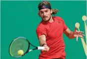  ??  ?? Stefanos Tsitsipas of Greece plays a return during his quarterfin­al match against Spain’s Alejandro Davidovich Fokina on Day Seven of the Monte-Carlo ATP Masters Series tournament in Monaco on Friday. —