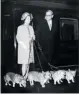  ??  ?? Queen Elizabeth arrives at King’s Cross railway station in London on Oct. 15, 1969, with her four corgi dogs.