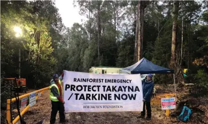  ?? Photograph: Bob Brown Foundation ?? Protesters near the proposed tailings dam site in Tasmania’s takayna/Tarkine wilderness in June. A legal threat from conservati­onists has stopped work at the site.