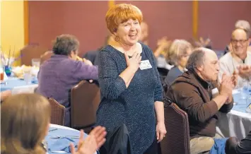  ?? ADOLPHE PIERRE-LOUIS/JOURNAL ?? Rhonda Seidenwurm thanks her guests, many of them friends she knew only from Facebook. She invited them to celebrate her 70th birthday Monday, which was also National Make a Friend Day.