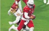  ?? NORM HALL/GETTY IMAGES ?? Arizona’s Kyler Murray beats Washington’s Troy Apke (30) for his second rushing touchdown of Sunday’s game.