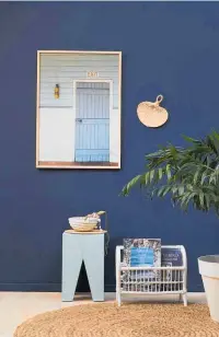  ?? Photo / Bryce Carleton ?? Bring coastal indoors with all the colours of the beach, like this room with walls in Resene Indian Ink and floor in R. Colorwood Whitewash. Project by Kate Alexander.