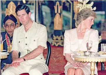  ?? — AFP file photos ?? Charles and Diana watching Indonesian tribal dancers in Yogyakarta, Indonesia, on Nov 5, 1989. (Below) Prince Charles and his wife Camilla, in Florence, during a six-day visit to Italy and the Vatican.