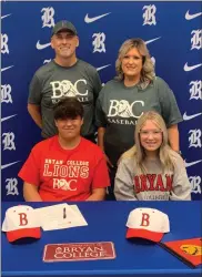  ?? Contribute­d ?? Surrounded by family members Keith, Shilloy and Rachel Bates, Ringgold senior Robbie Bates signed on to continue his baseball career at Bryan College in a ceremony on May 26 at the high school.